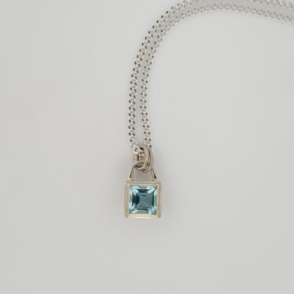ATTICUS Pendant in sterling silver, set with a Swiss blue topaz on a diamond-cut curb chain. Handmade in Melbourne by AGOVIA.
