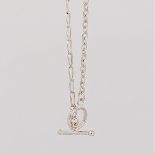 ATTIS Chain in sterling silver, combining curb and cable links with a fob clasp. Worn as a neck chain or doubled wrist chain. AGOVIA Melbourne.