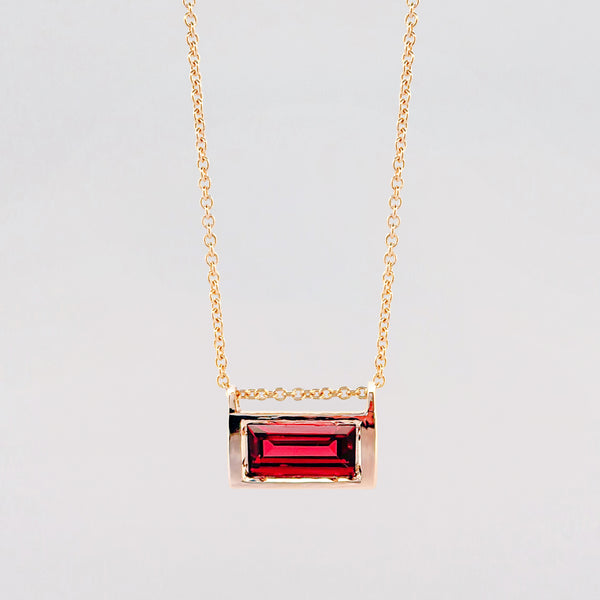 VIVIANA Pendant in 9ct yellow gold, set with a baguette-cut Almandine garnet. Handmade in Melbourne by AGOVIA.