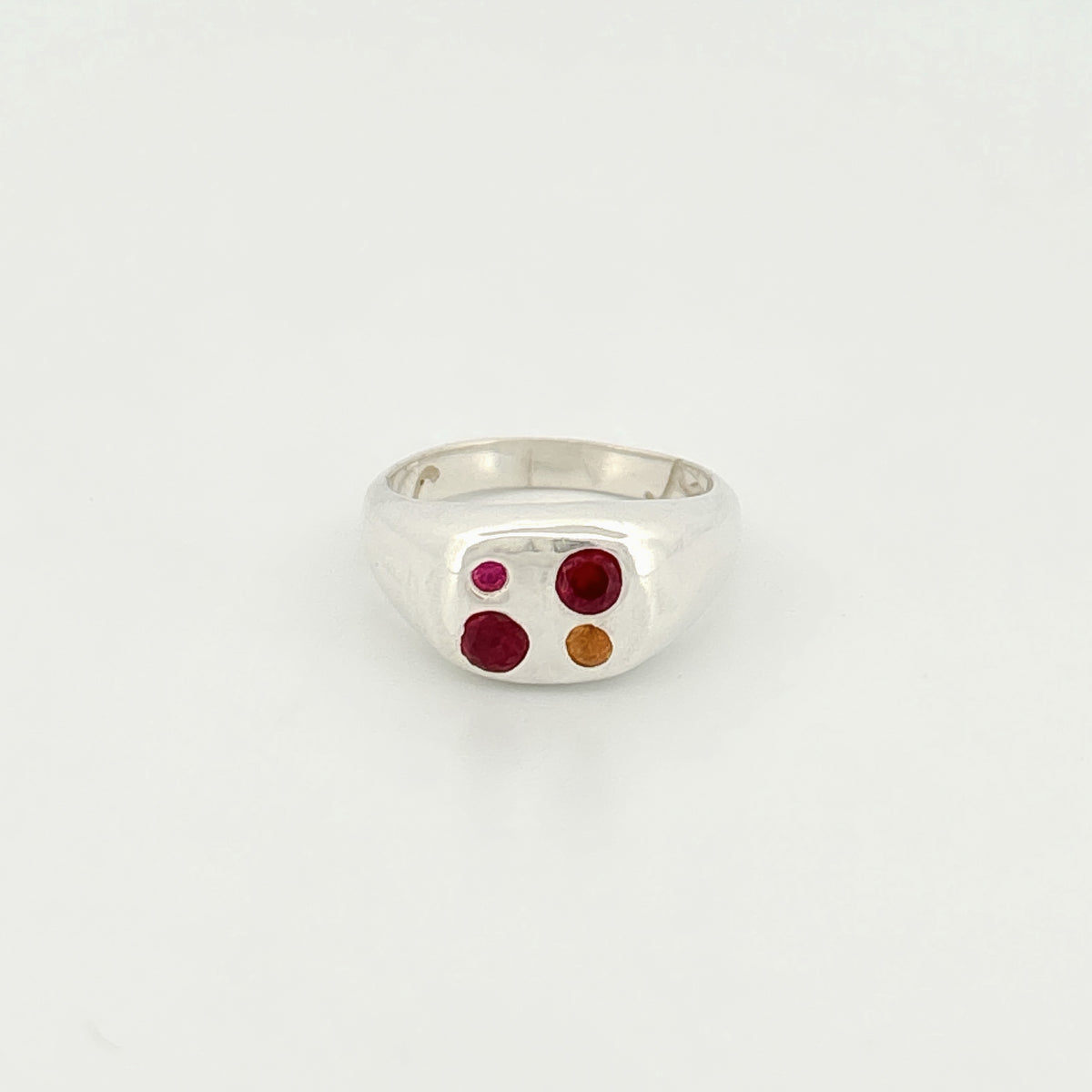 ALUMINO Ring in sterling silver, set with three round-cut stones: a yellow sapphire, ruby and hydrothermal ruby. Handmade in Melbourne by AGOVIA.