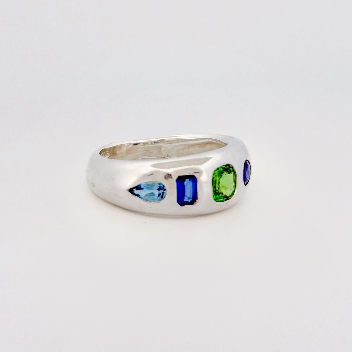 AKIRA Ring in sterling silver, scattered with tsavorite garnet, Ceylon sapphire and aquamarine. Handmade in Melbourne by AGOVIA.