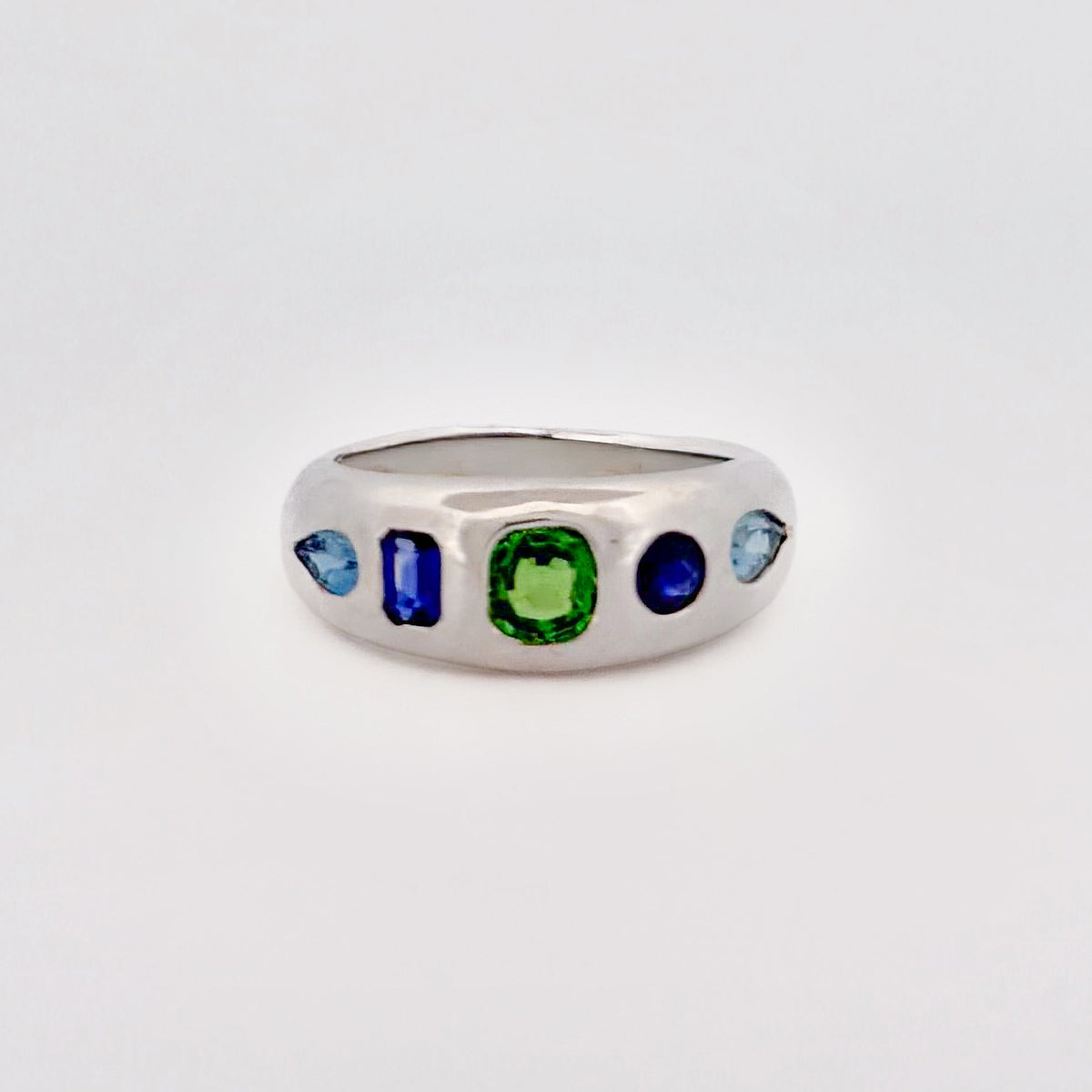 AKIRA Ring in sterling silver, scattered with tsavorite garnet, Ceylon sapphire and aquamarine. Handmade in Melbourne by AGOVIA.