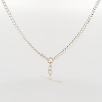 Silver necklace with a clasp on a light gray background
