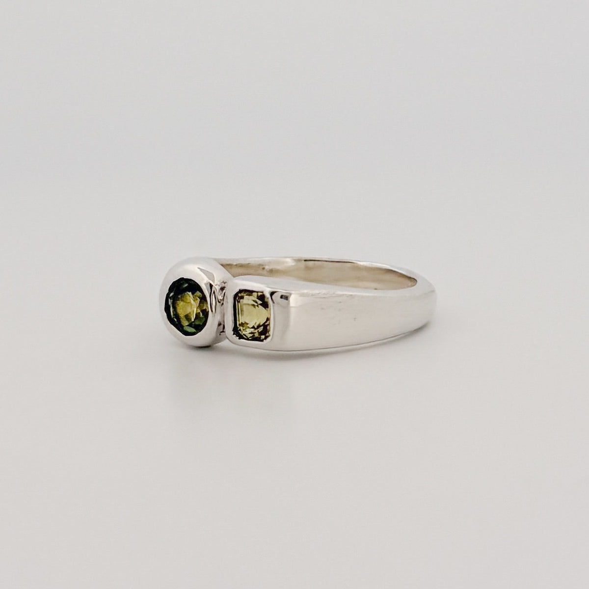ALEC Ring in sterling silver, set with an Asscher-cut yellow sapphire and unheated Australian parti sapphire. SIMPATICO collection by AGOVIA, Melbourne.