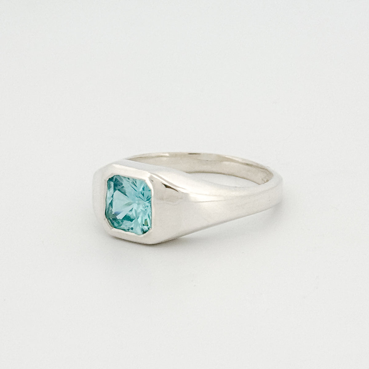 BACCHUS signet ring in sterling silver, set with a radiant-cut blue zircon. Handmade in Melbourne by AGOVIA.