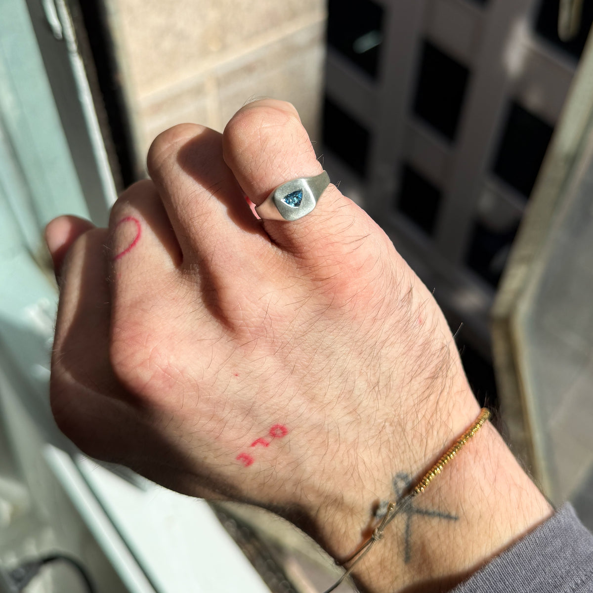 FACETIA signet ring in sterling silver, set with a trapezoid-cut Santa Maria aquamarine. Handmade in Melbourne by AGOVIA.