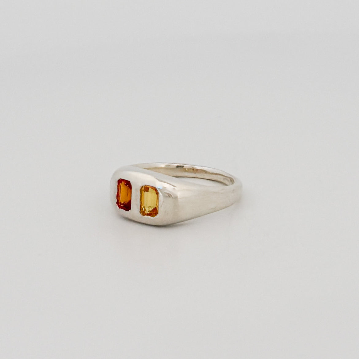 FLAVIA Ring in sterling silver, set with emerald-cut orange and yellow sapphires. Handmade in Melbourne by AGOVIA.
