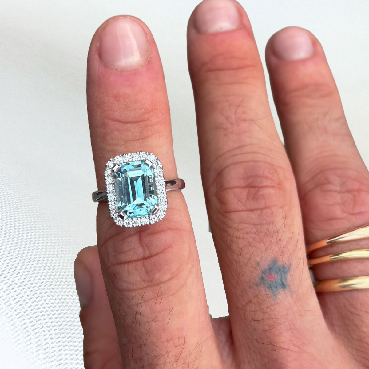 AZUL AMOR Ring set with an Afghan aquamarine and diamond halo. Available in 18ct gold or platinum. Handmade in Melbourne by AGOVIA.