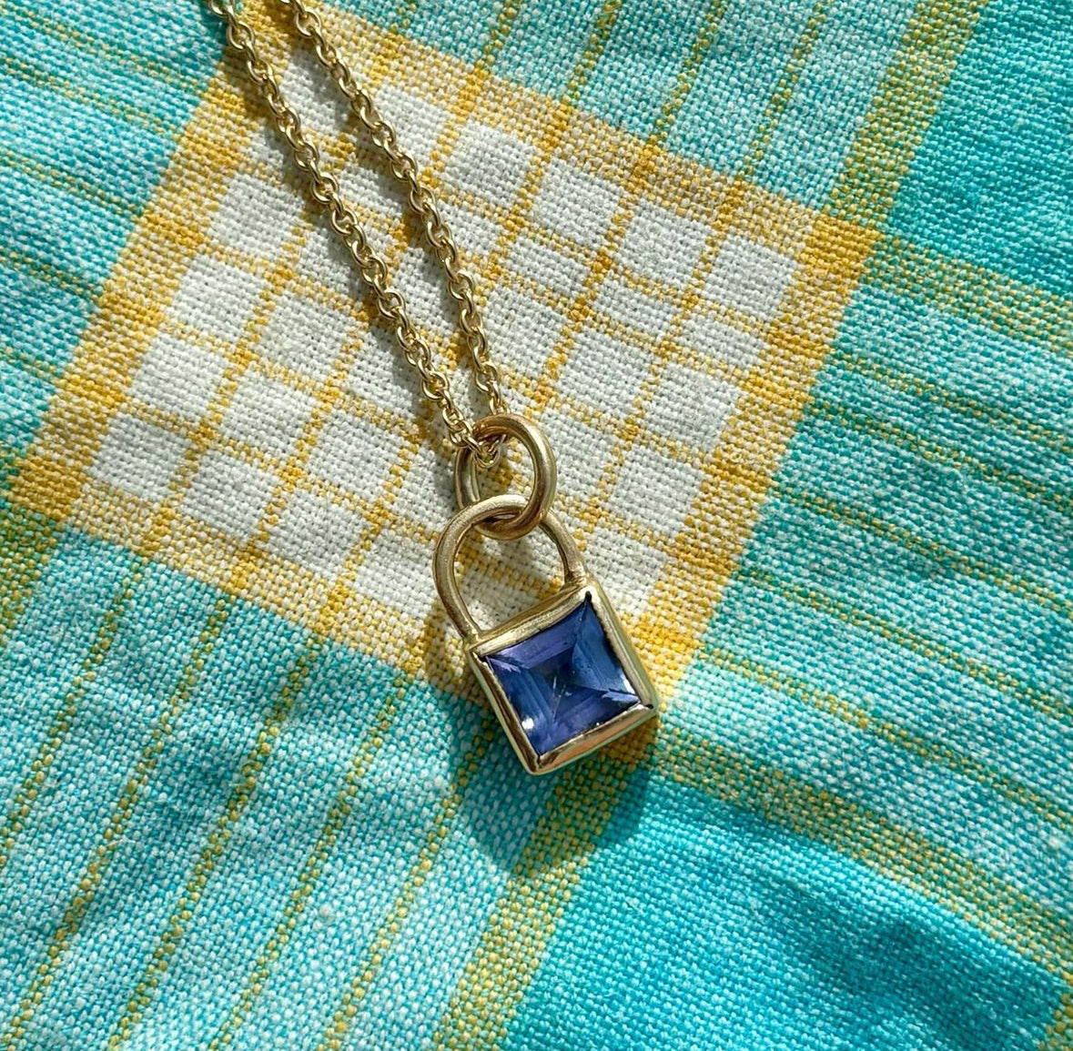 GASPAR Pendant in 9ct yellow gold, set with a 6mm Carre-cut tanzanite. Handmade in Melbourne by AGOVIA.