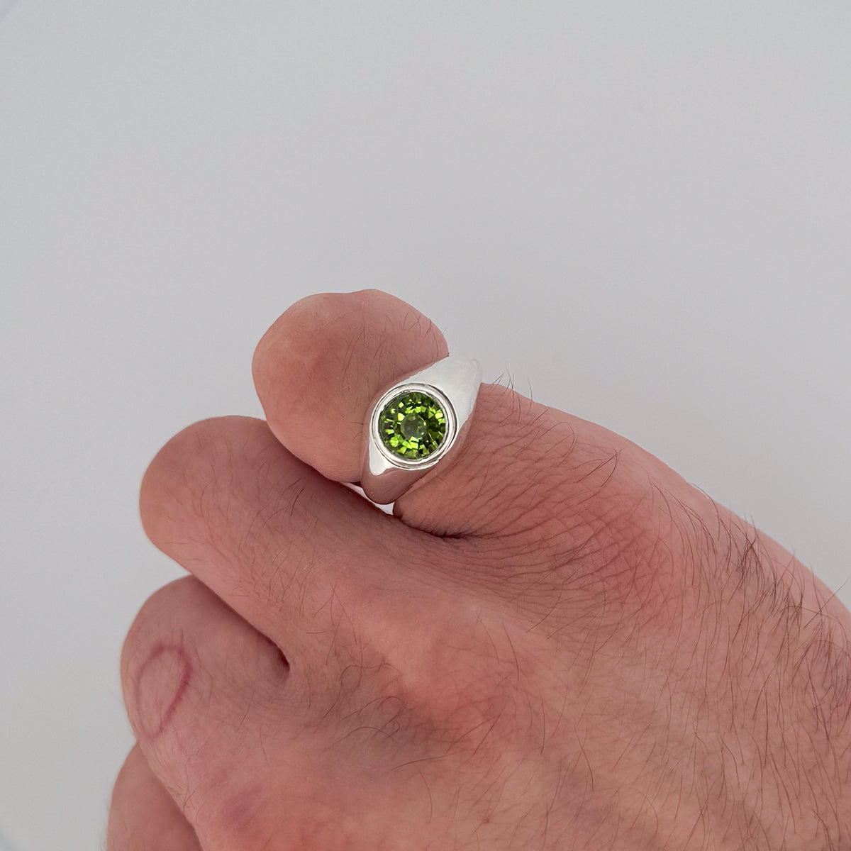 VARO Ring in sterling silver, set with a round-cut peridot solitaire. Handmade in Melbourne by AGOVIA.