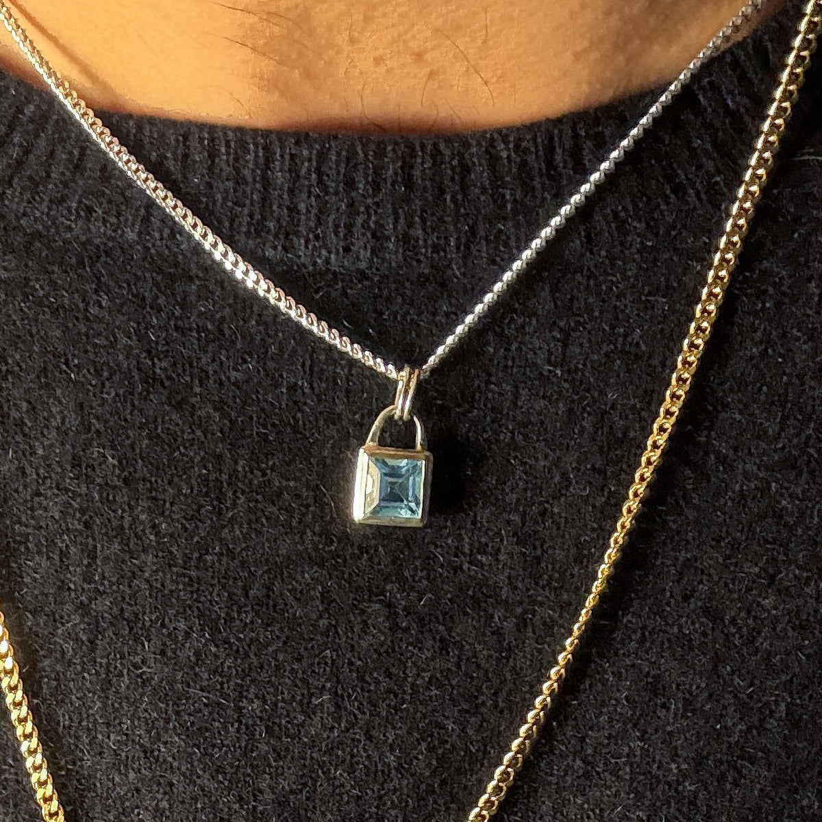 ATTICUS Pendant in sterling silver, set with a Swiss blue topaz on a diamond-cut curb chain. Handmade in Melbourne by AGOVIA.