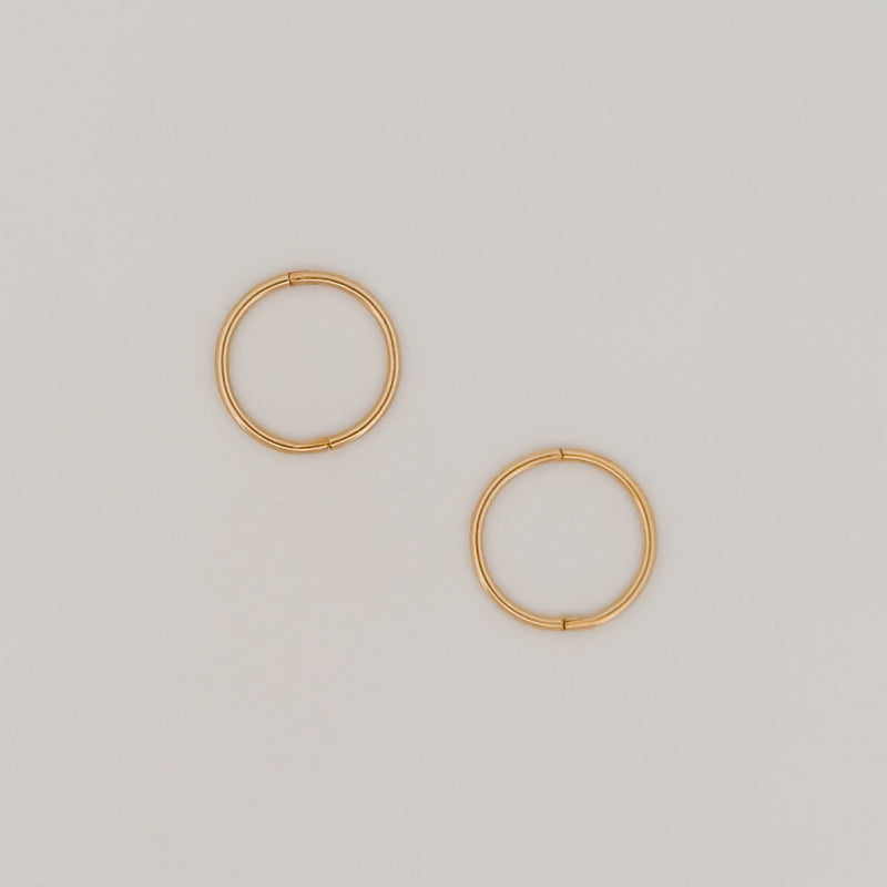 OLE sleeper hoops in solid 9ct yellow gold. Lightweight hinged earrings by AGOVIA.