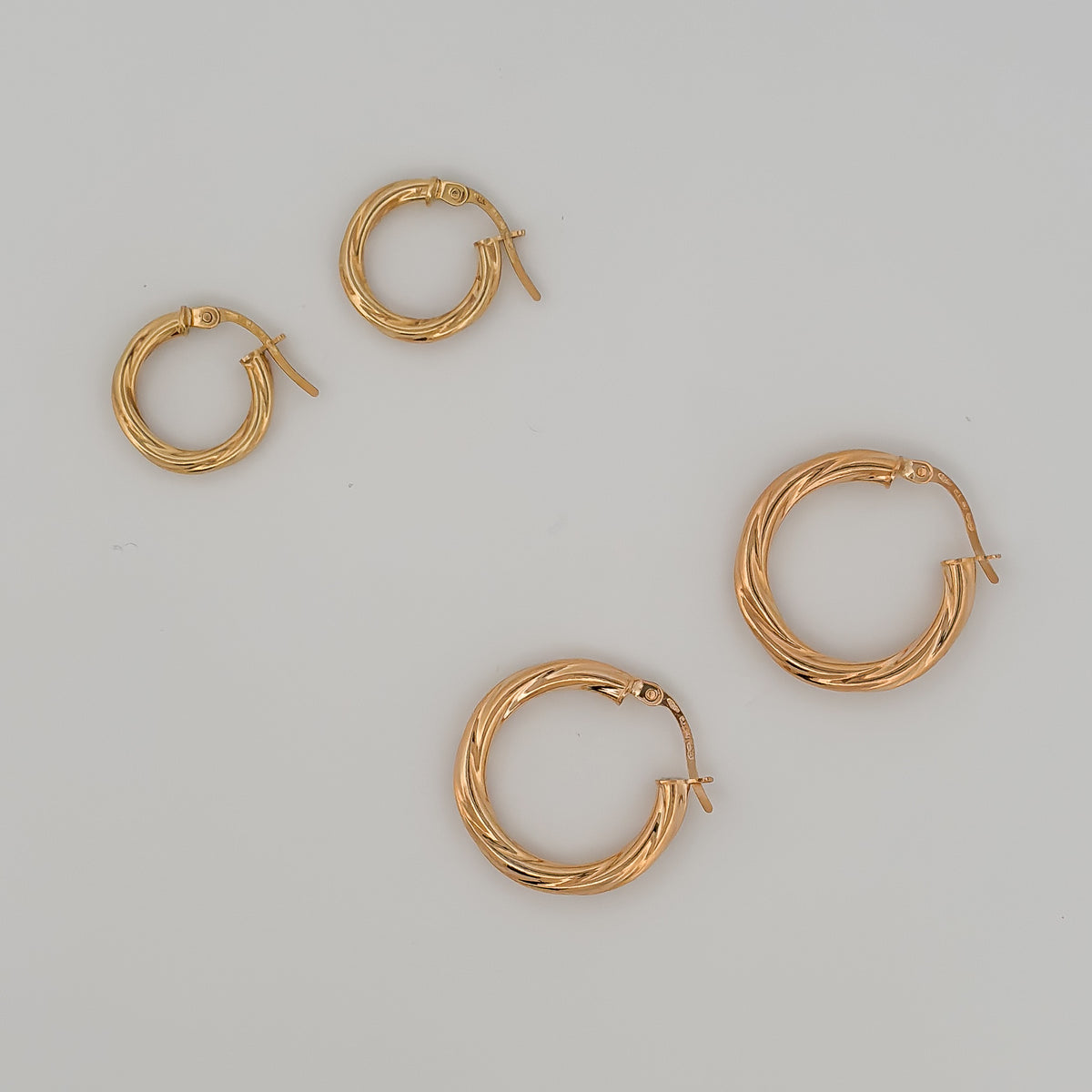 AJACCIO Hoops in solid 9ct or 18ct yellow gold, twisted design. AGOVIA fine jewellery.