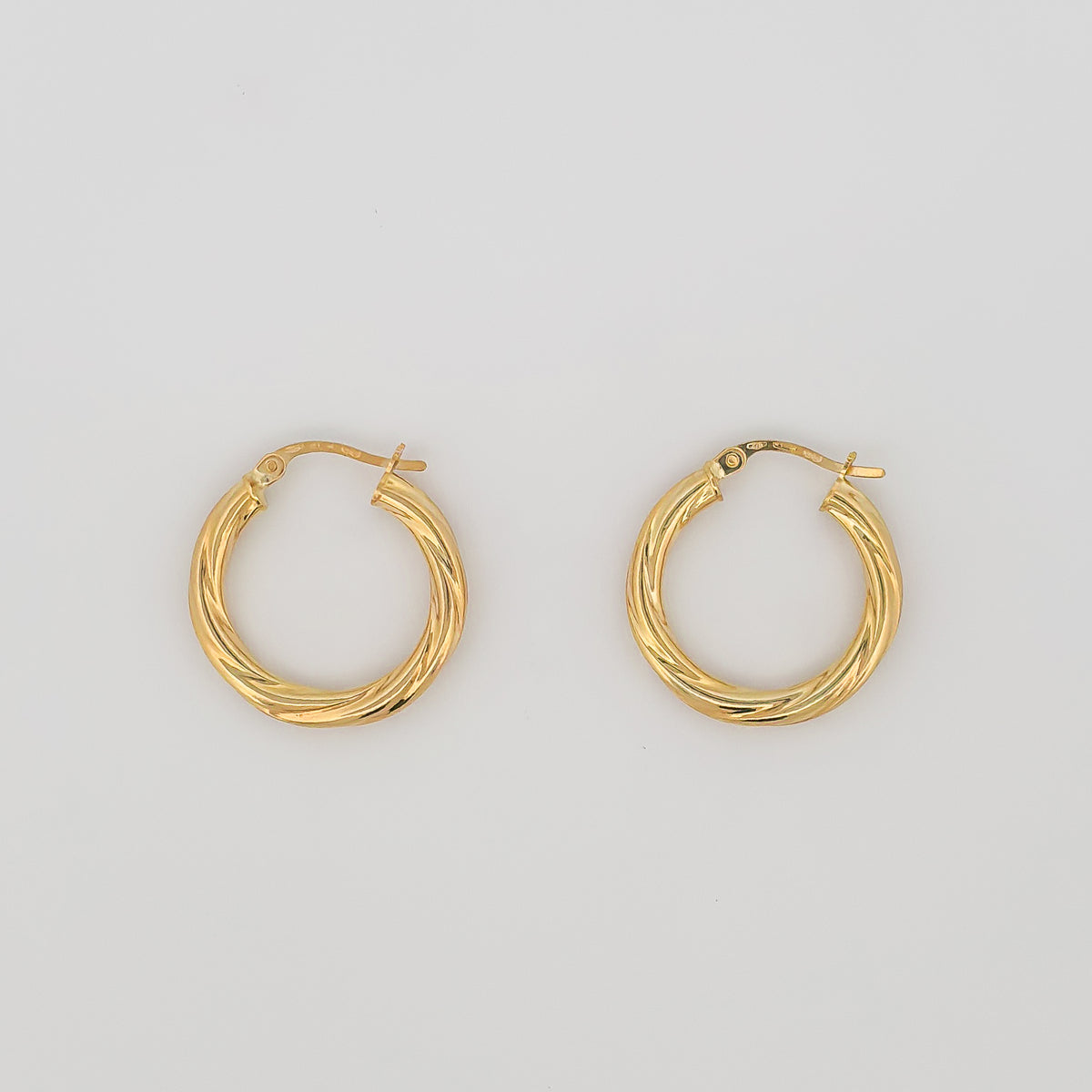 AJACCIO Hoops in solid 9ct or 18ct yellow gold, twisted design. AGOVIA fine jewellery.