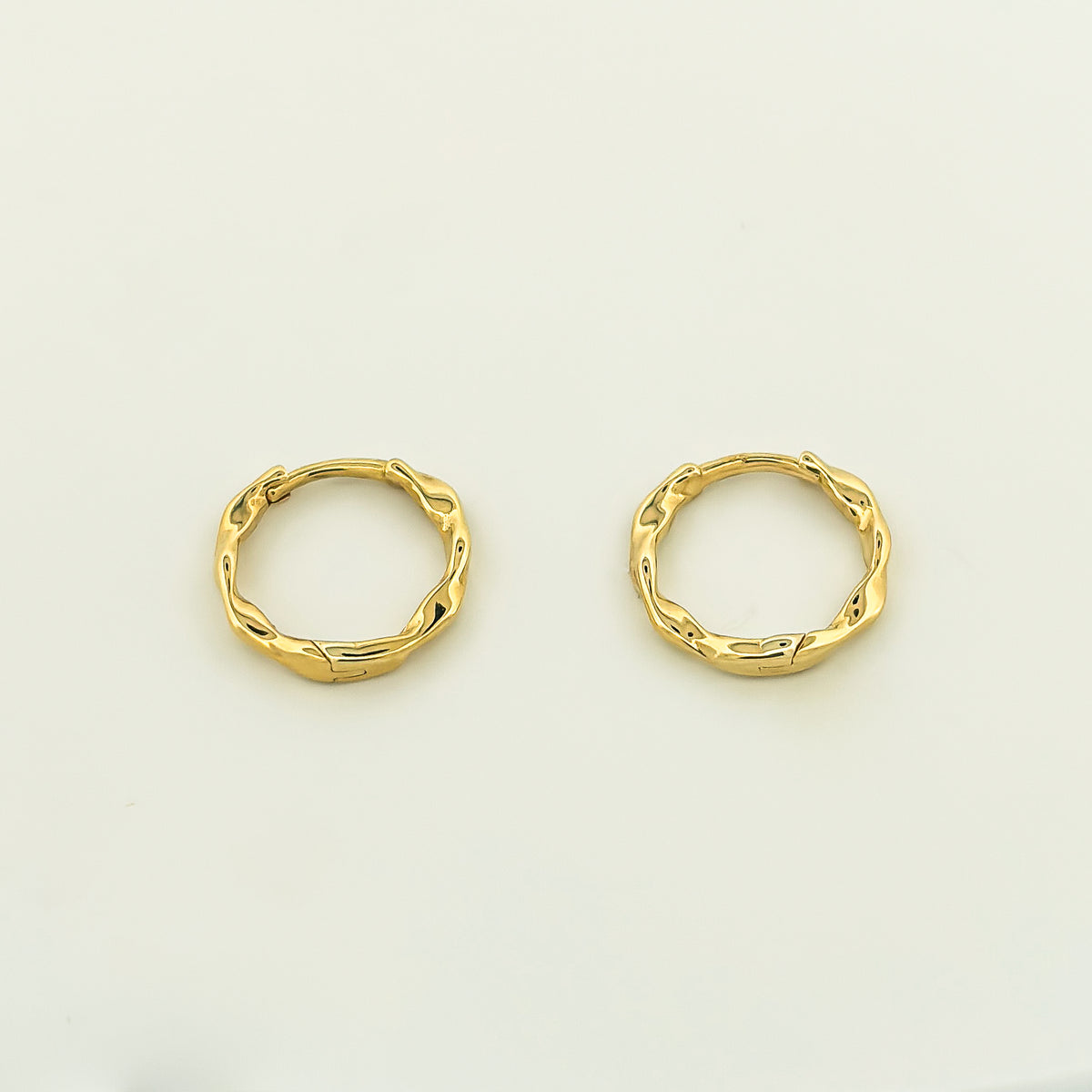 ARIMA Hoops in solid 9ct or 18ct yellow gold, twisted design. AGOVIA fine jewellery.