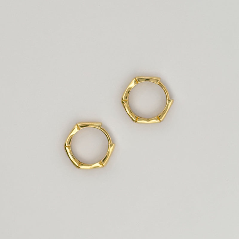 CALYPSO Hoops in solid 9ct or 18ct yellow gold, geometric rattan-inspired design. AGOVIA fine jewellery.