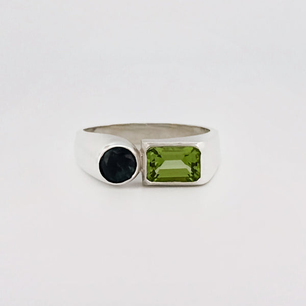 ARANSO III Ring in sterling silver, set with an emerald-cut peridot and round Australian sapphire. Handmade in Melbourne by AGOVIA.