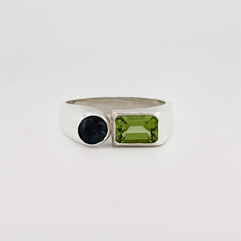 ARANSO III Ring in sterling silver, set with an emerald-cut peridot and round Australian sapphire. Handmade in Melbourne by AGOVIA.