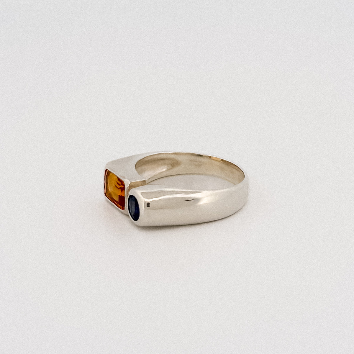 ARANSO Ring in sterling silver, set with an emerald-cut citrine and round blue sapphire. Handmade in Melbourne by AGOVIA.