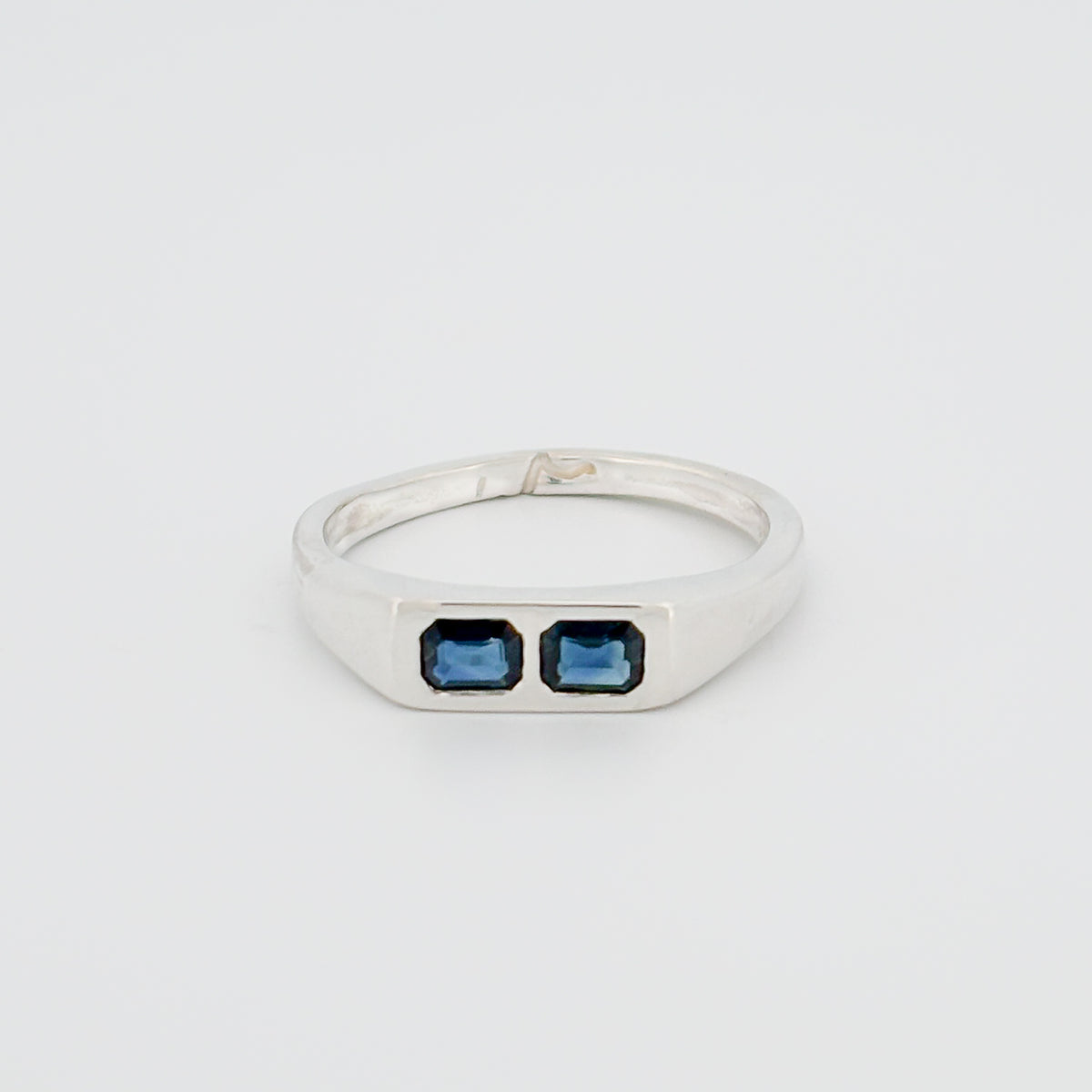 AYXA Ring in silver, set with an emerald-cut Australian blue sapphire. Handmade in Melbourne by AGOVIA.
