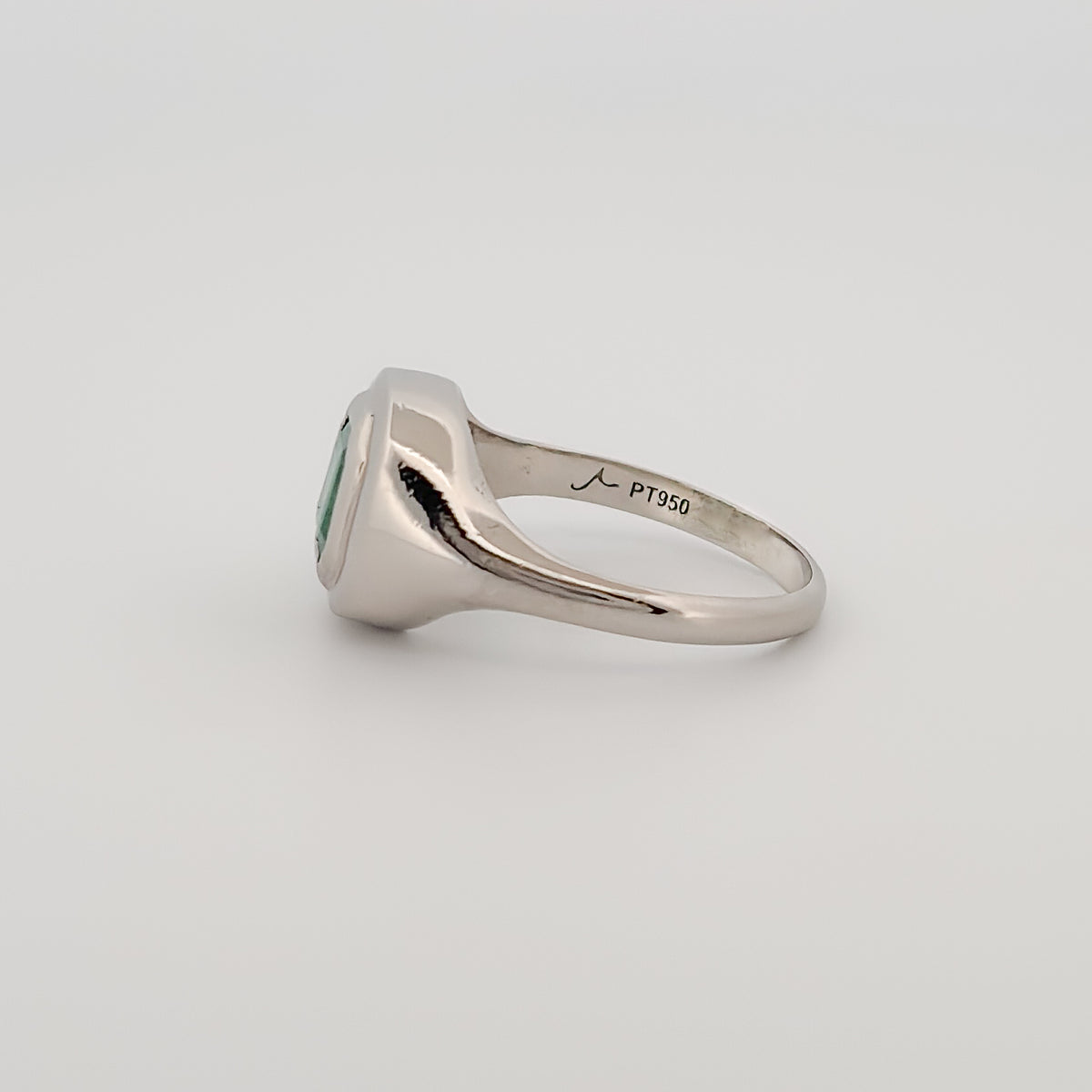 CEDAR signet ring in platinum, set with an emerald-cut Zambian emerald. Handmade in Melbourne by AGOVIA.