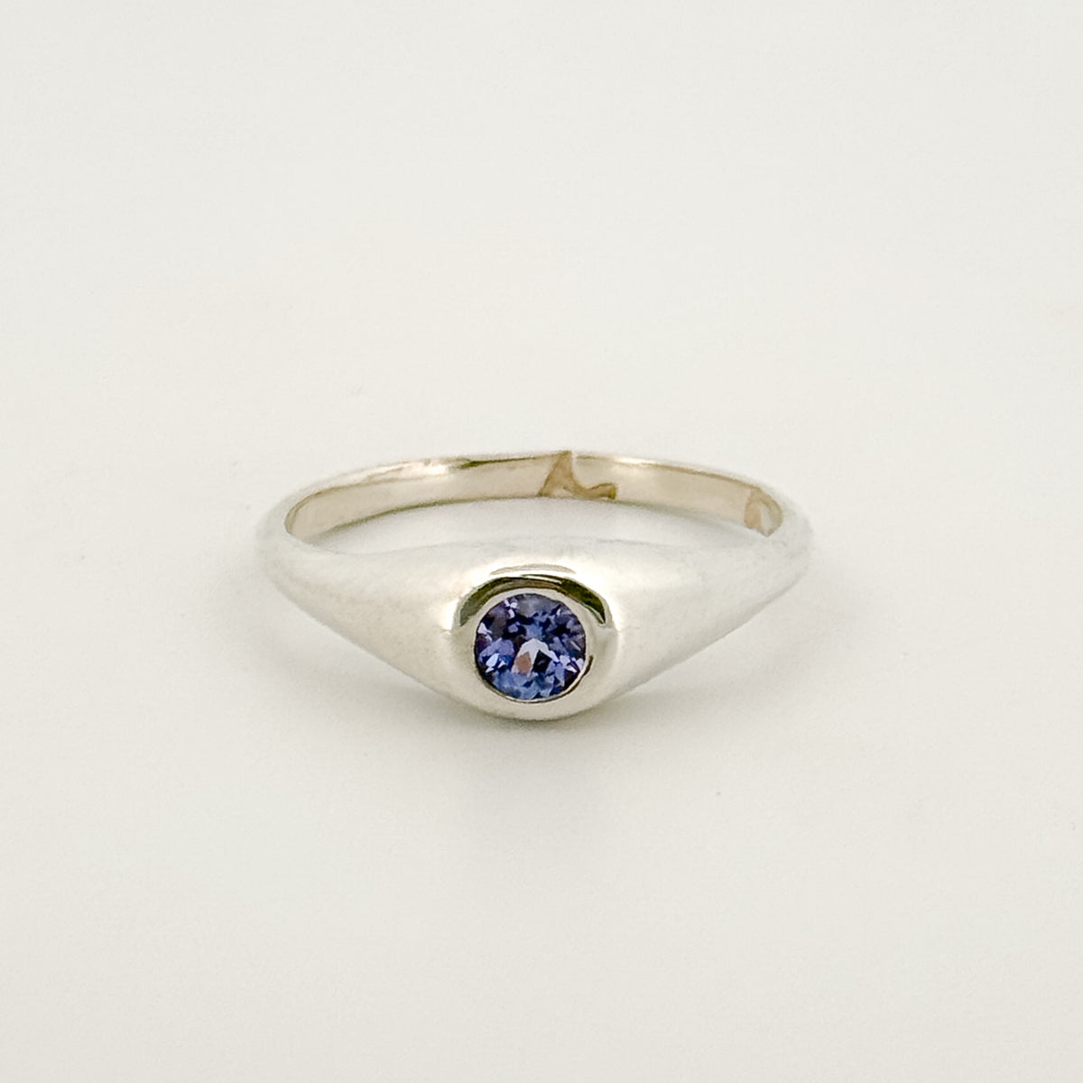 LOLA Ring in sterling silver, set with a round-cut tanzanite. Handmade in Melbourne by AGOVIA.