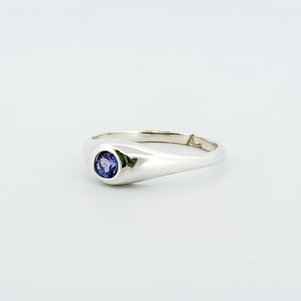 LOLA Ring in sterling silver, set with a round-cut tanzanite. Handmade in Melbourne by AGOVIA.