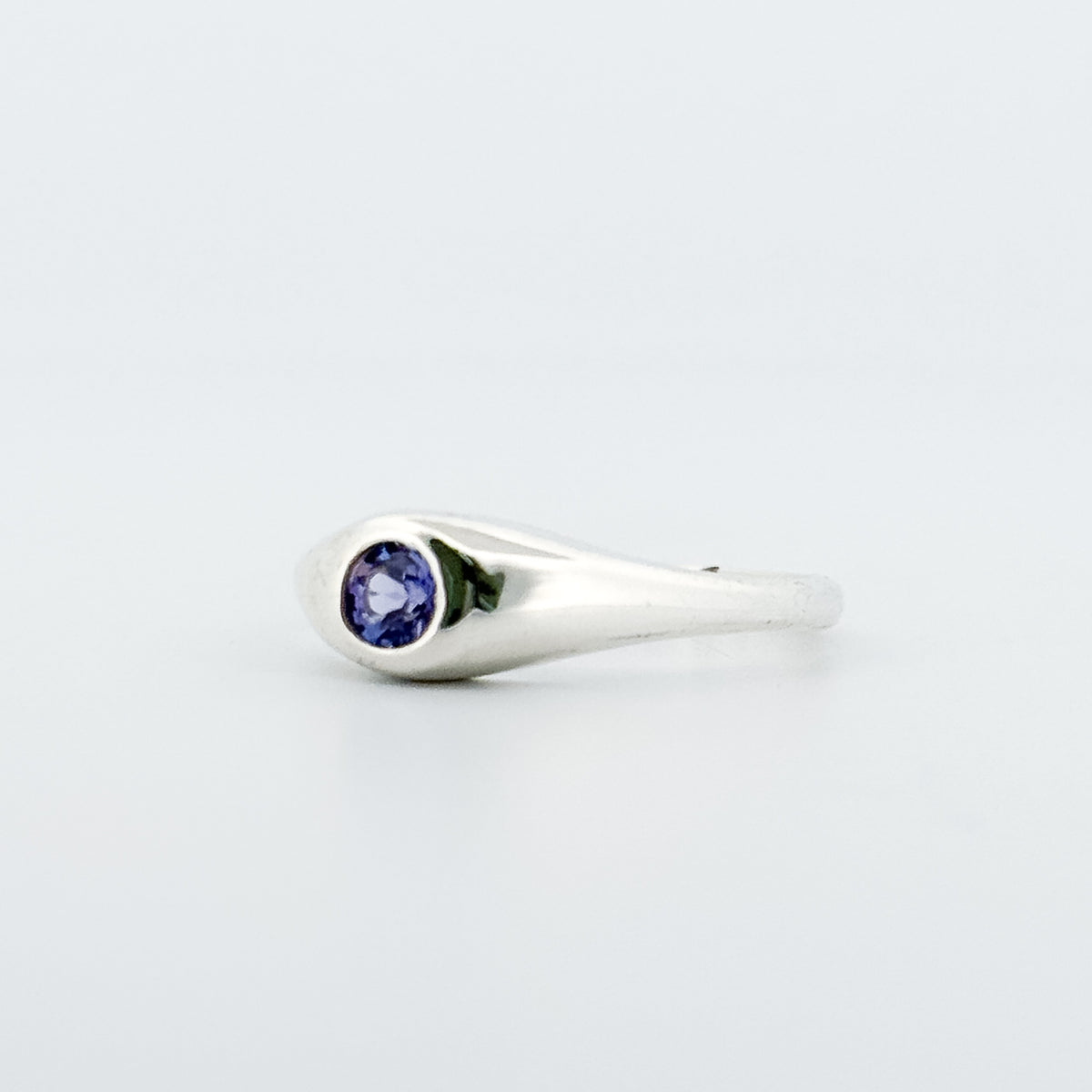 LOLA Ring in sterling silver, set with a round-cut tanzanite. Handmade in Melbourne by AGOVIA.