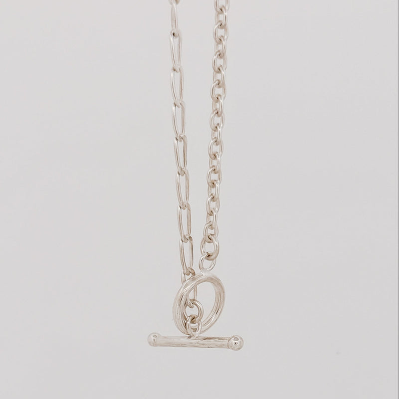 ATTIS Chain in sterling silver, combining curb and cable links with a fob clasp. Worn as a neck chain or doubled wrist chain. AGOVIA Melbourne.