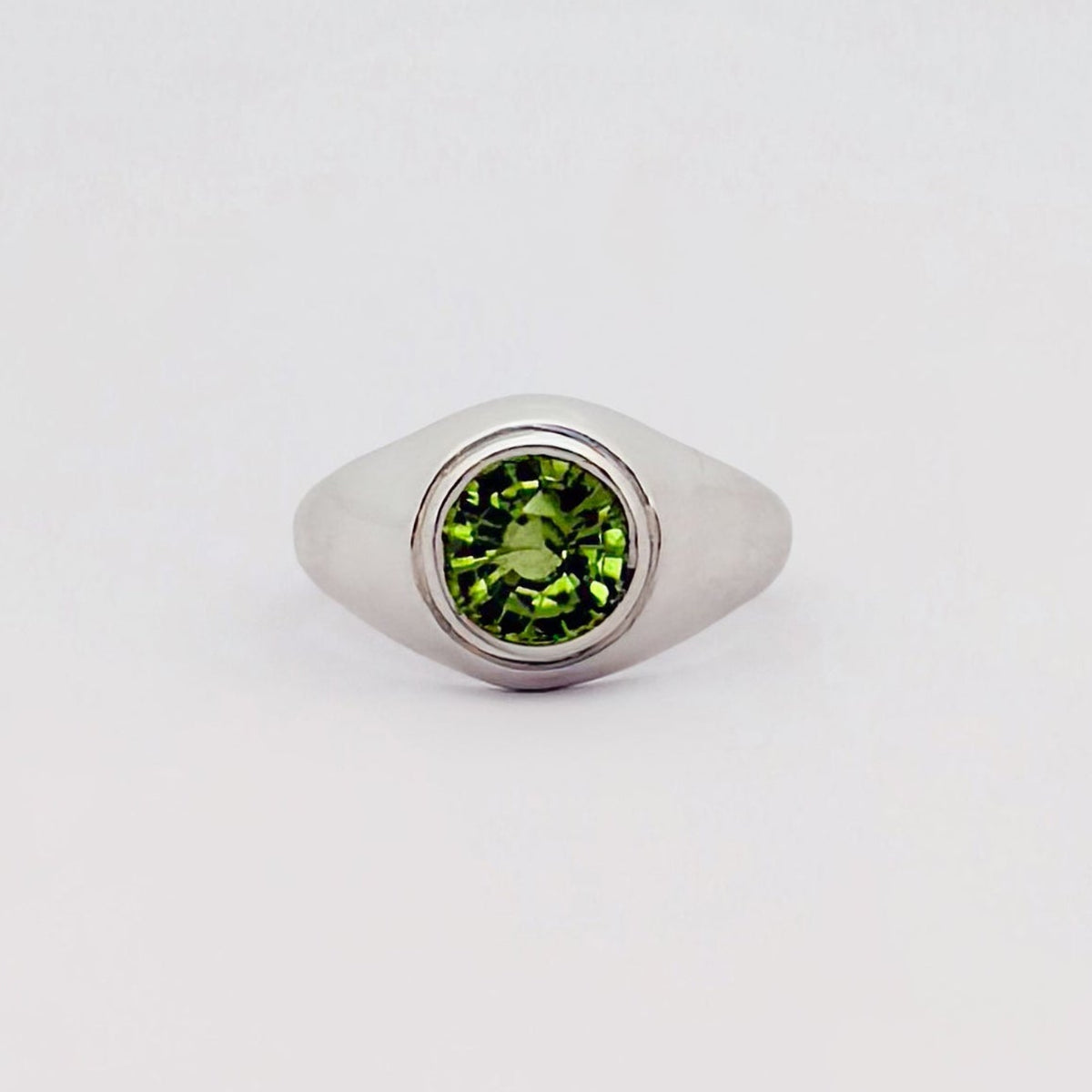 VARO Ring in sterling silver, set with a round-cut peridot solitaire. Handmade in Melbourne by AGOVIA.