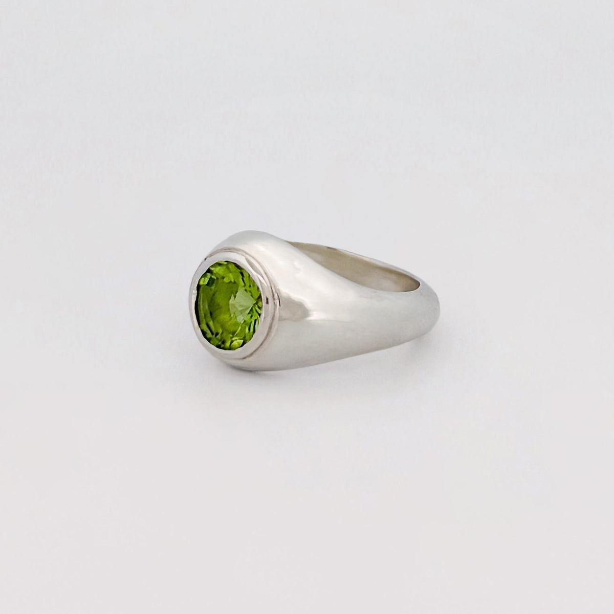 VARO Ring in sterling silver, set with a round-cut peridot solitaire. Handmade in Melbourne by AGOVIA.