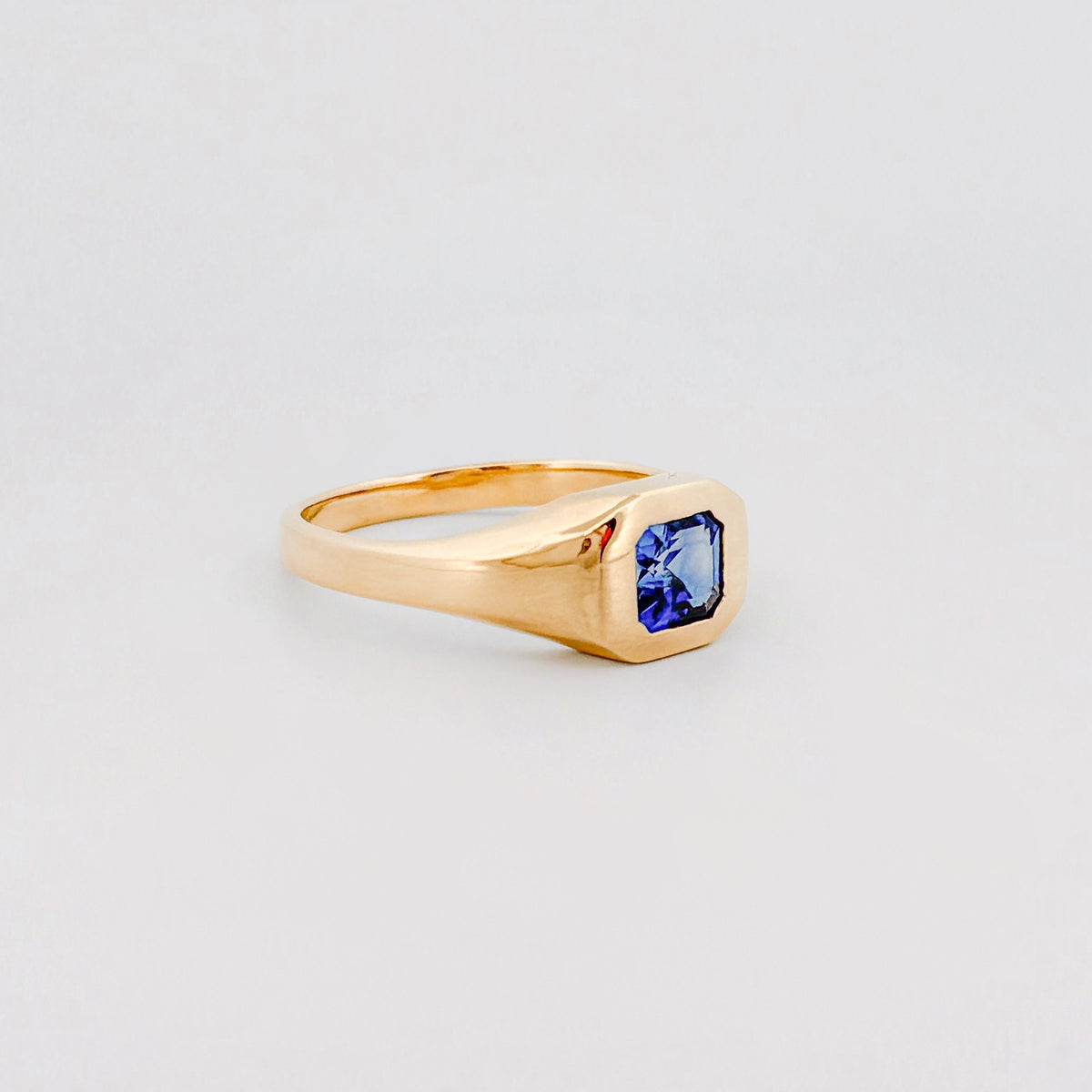 BACCHUS signet ring in 14ct yellow gold, set with an Asscher-cut Ceylon sapphire. Handmade in Melbourne by AGOVIA.