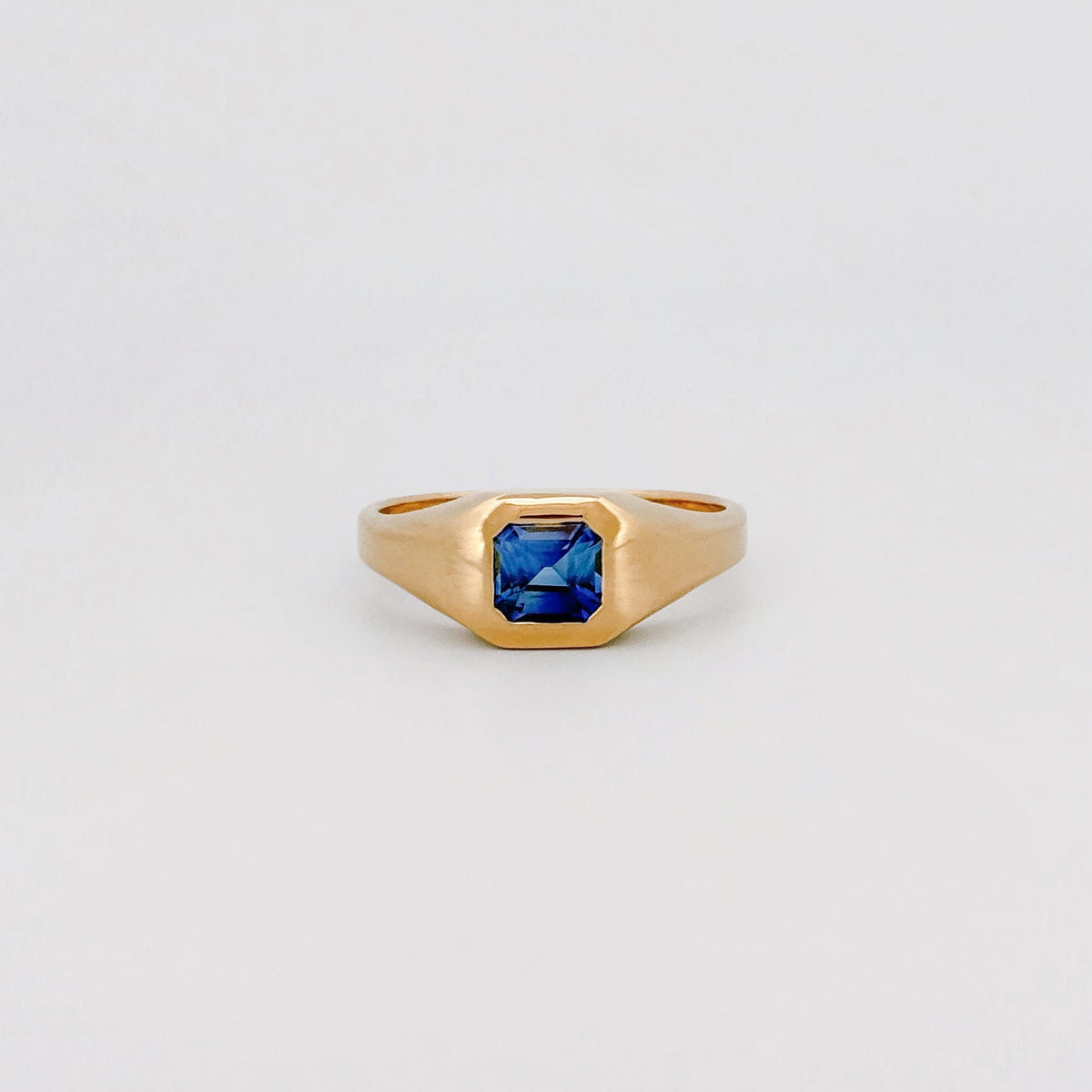 BACCHUS signet ring in 14ct yellow gold, set with an Asscher-cut Ceylon sapphire. Handmade in Melbourne by AGOVIA.