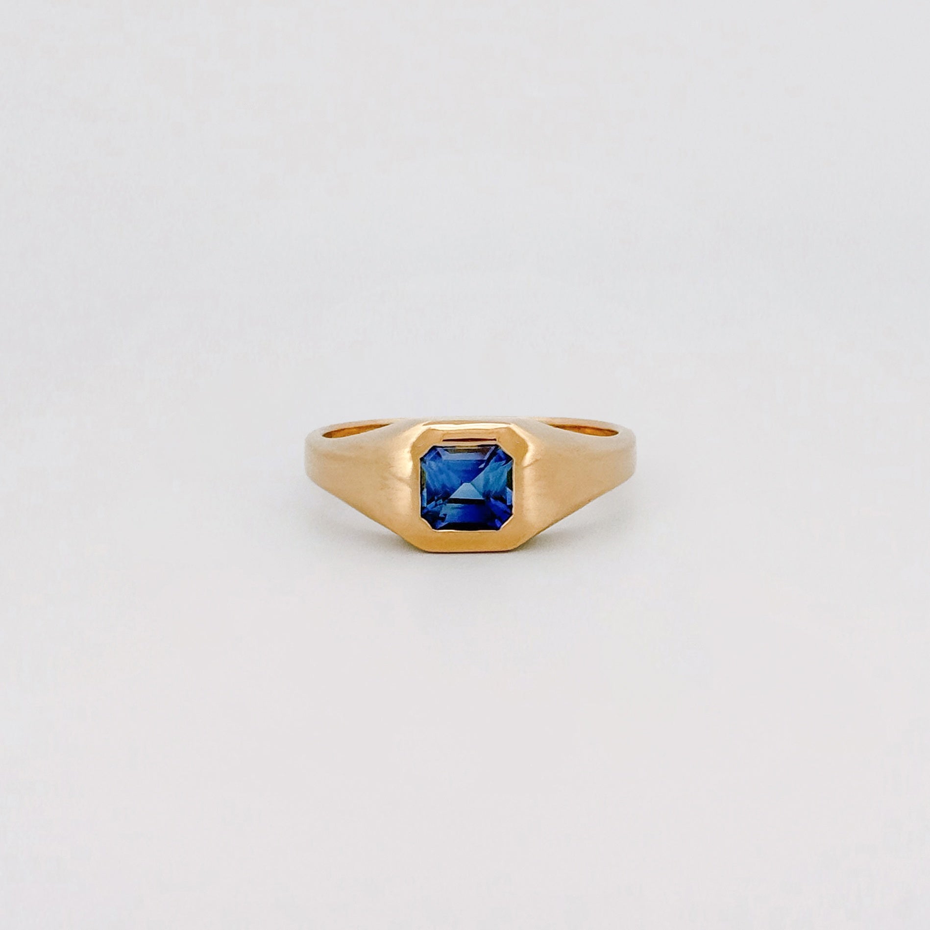 BACCHUS signet ring in 14ct yellow gold, set with an Asscher-cut Ceylon sapphire. Handmade in Melbourne by AGOVIA.