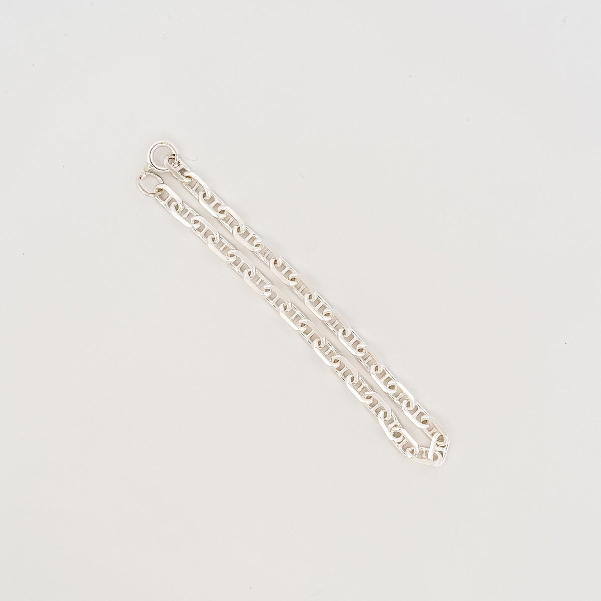 MARINER wrist chain in sterling silver, angular mariner links with a bolt ring clasp. Italian-made for AGOVIA.