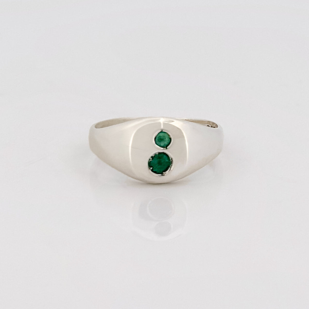 PERPETUAL Signet in Argentium silver, set with two round hydrothermal emeralds, front view. Made in Melbourne by AGOVIA.