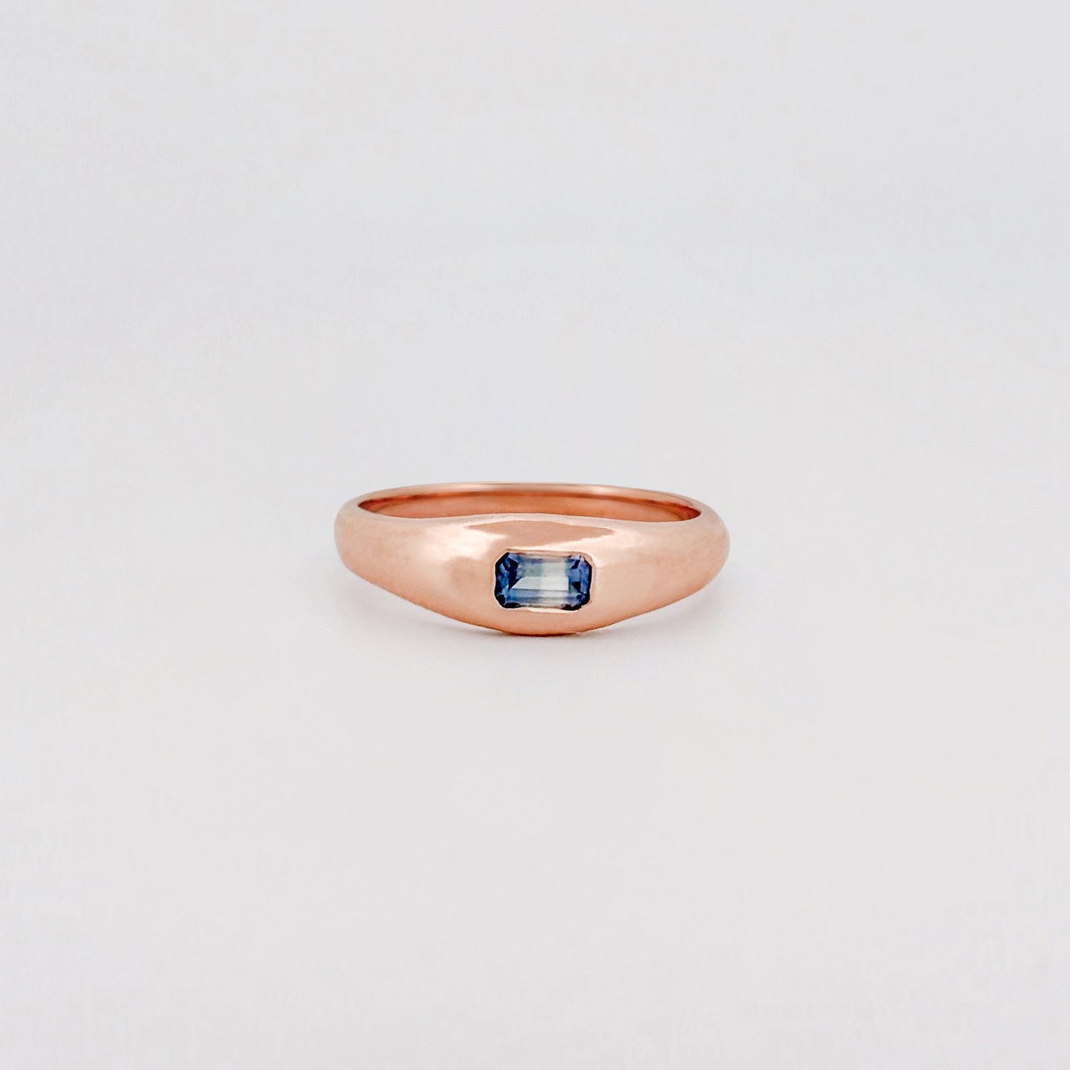 LILIAN Ring in recycled 9ct pink gold, set with an emerald-cut ruby or blue Ceylon sapphire. Handmade in Melbourne by AGOVIA.