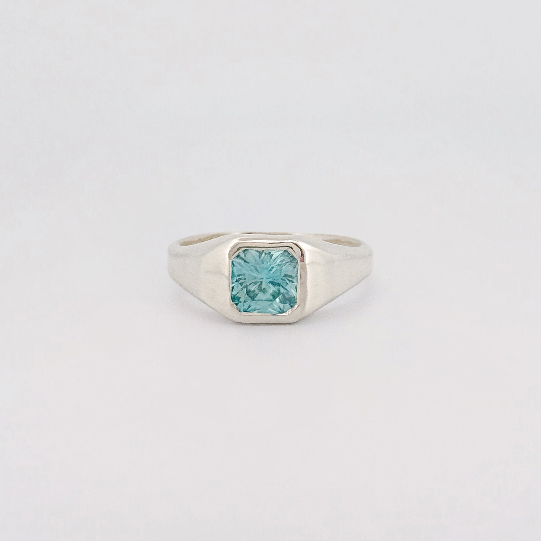 BACCHUS signet ring in recycled sterling silver, set with a radiant-cut blue zircon. Handmade in Melbourne by AGOVIA.