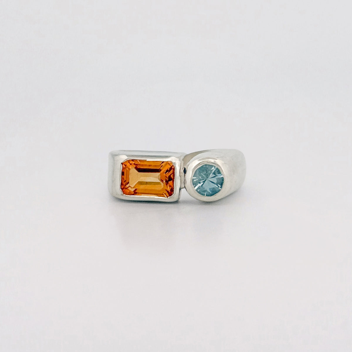 ARANSO Ring in sterling silver, set with a 7x5mm emerald-cut citrine and 4mm round aquamarine. Handmade in Melbourne by AGOVIA.