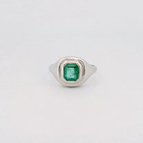CEDAR signet ring in recycled platinum, set with an emerald-cut Zambian emerald. Handmade in Melbourne by AGOVIA.