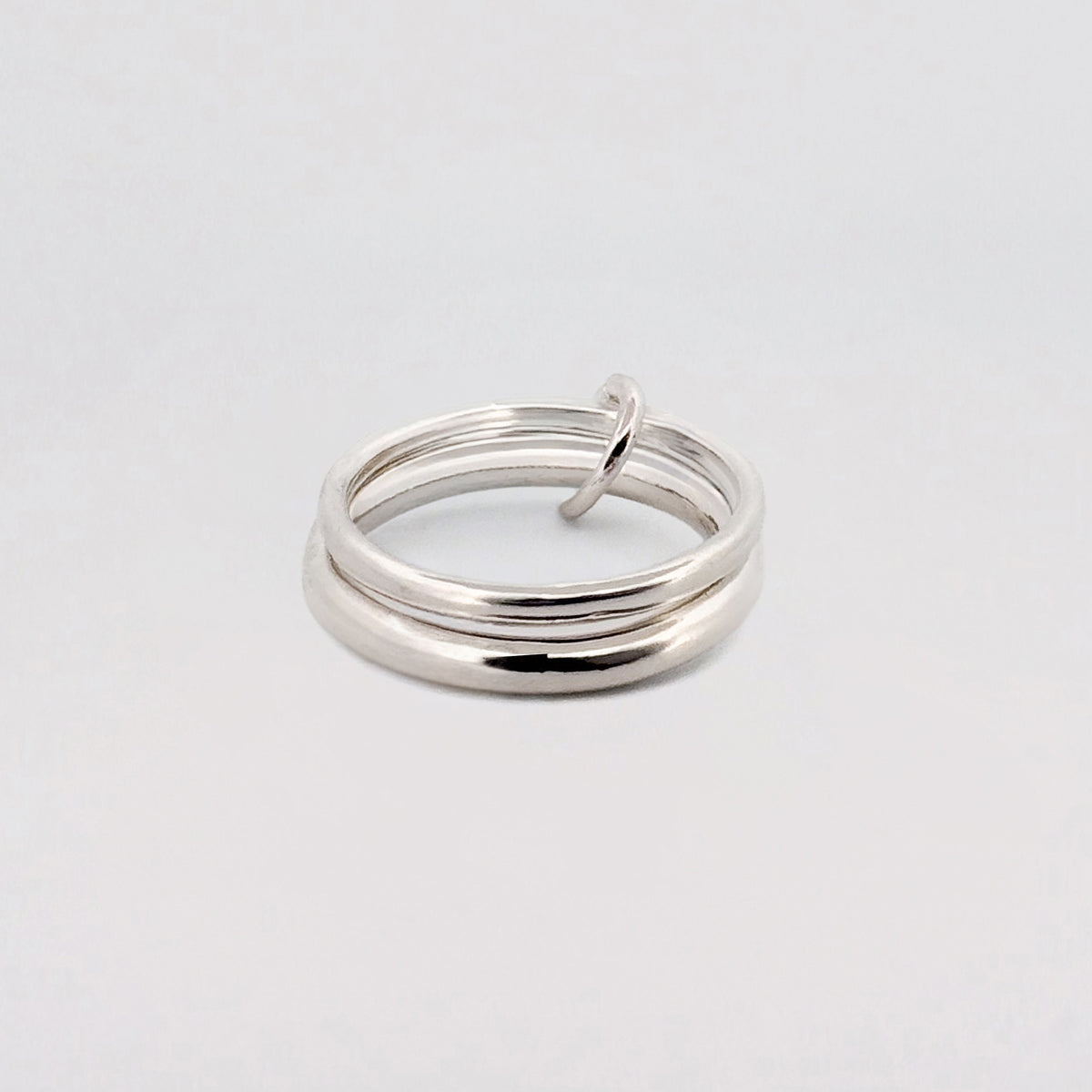 JUNO Ring in sterling silver, twin OLE bands joined by a smaller silver ring. Handmade in Melbourne by AGOVIA.