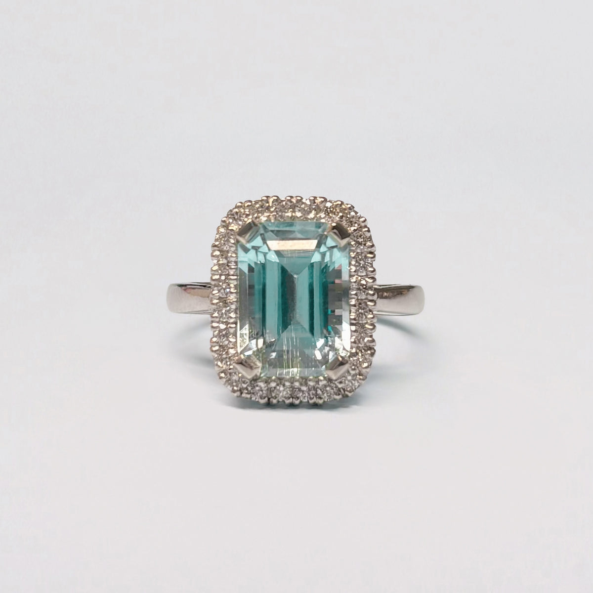 AZUL AMOR Ring set with an Afghan aquamarine and diamond halo. Available in 18ct gold or platinum. Handmade in Melbourne by AGOVIA.