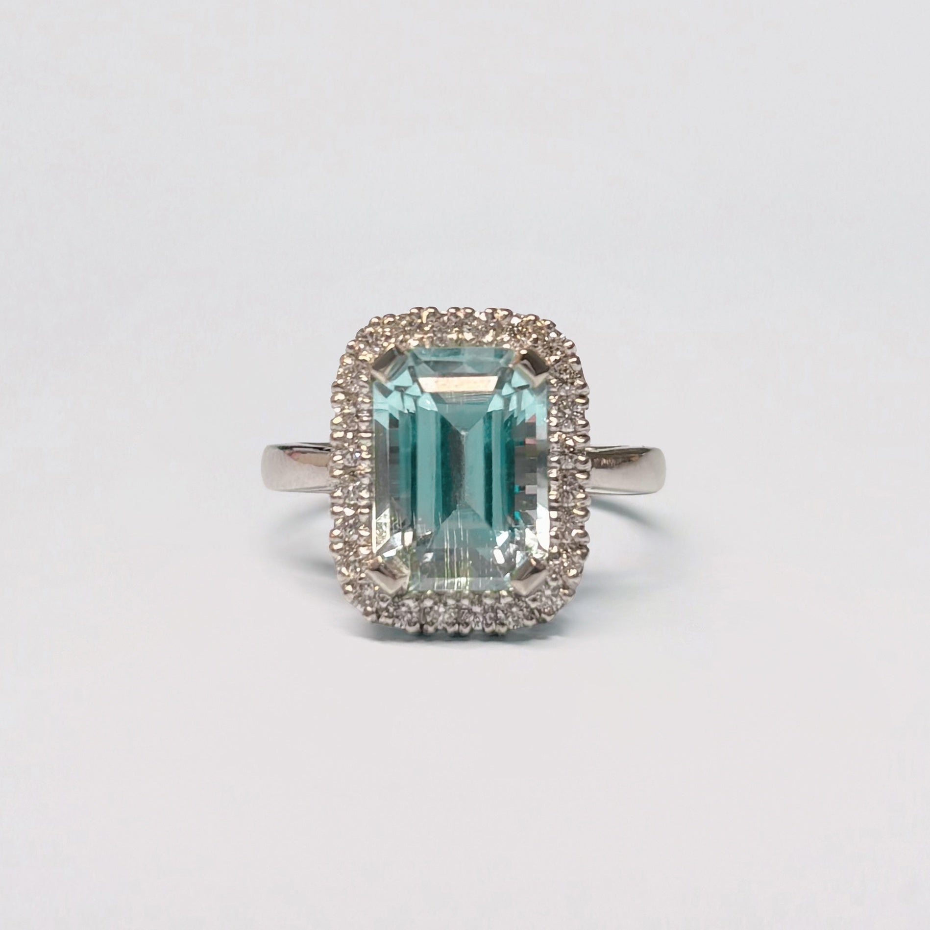 AZUL AMOR Ring set with an Afghan aquamarine and diamond halo. Available in 18ct gold or platinum. Handmade in Melbourne by AGOVIA.