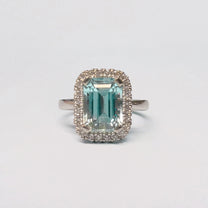 AZUL AMOR Ring set with an Afghan aquamarine and diamond halo. Available in 18ct gold or platinum. Handmade in Melbourne by AGOVIA.