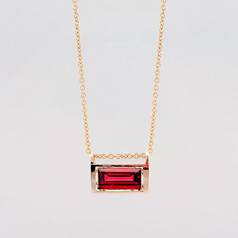 VIVIANA Pendant in 9ct yellow gold, set with a baguette-cut Almandine garnet. Handmade in Melbourne by AGOVIA.
