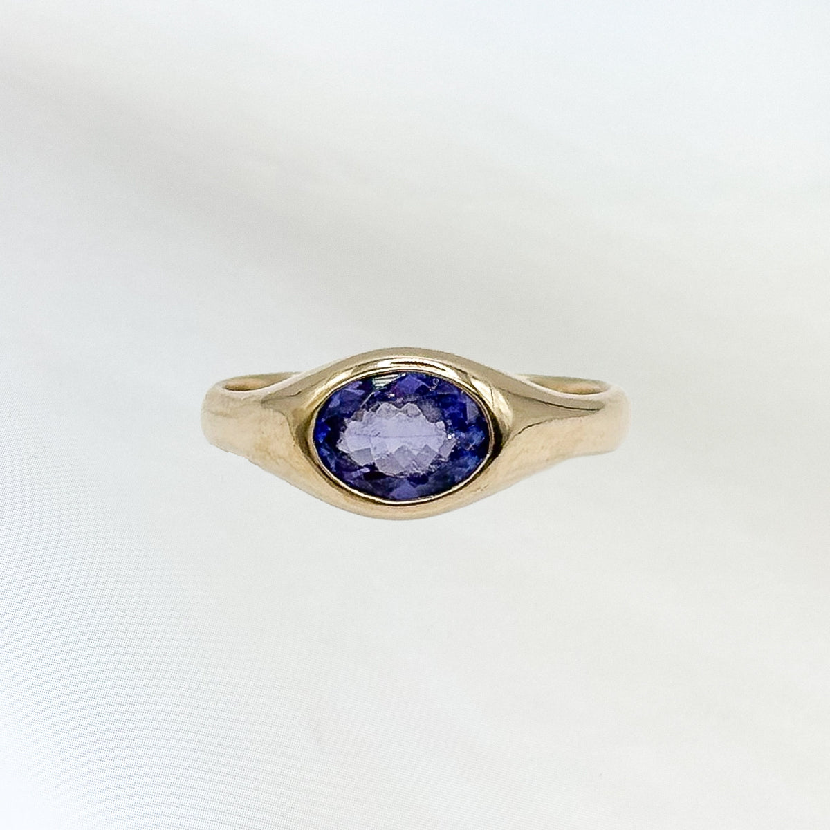 OO Ring in 9ct yellow gold, set with a 6x4mm oval-cut tanzanite. Handmade in Melbourne by AGOVIA.