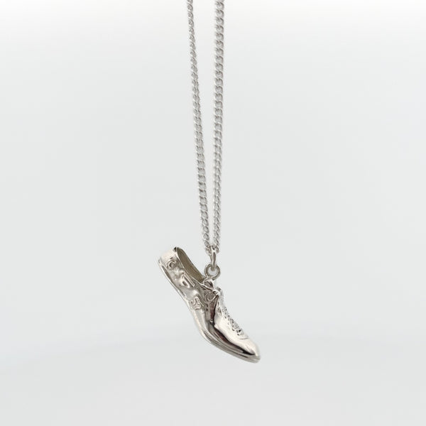 SPRINTT Pendant, a running shoe cast in Argentium silver or 18ct gold on a fine curb chain. Handmade in Melbourne by AGOVIA.