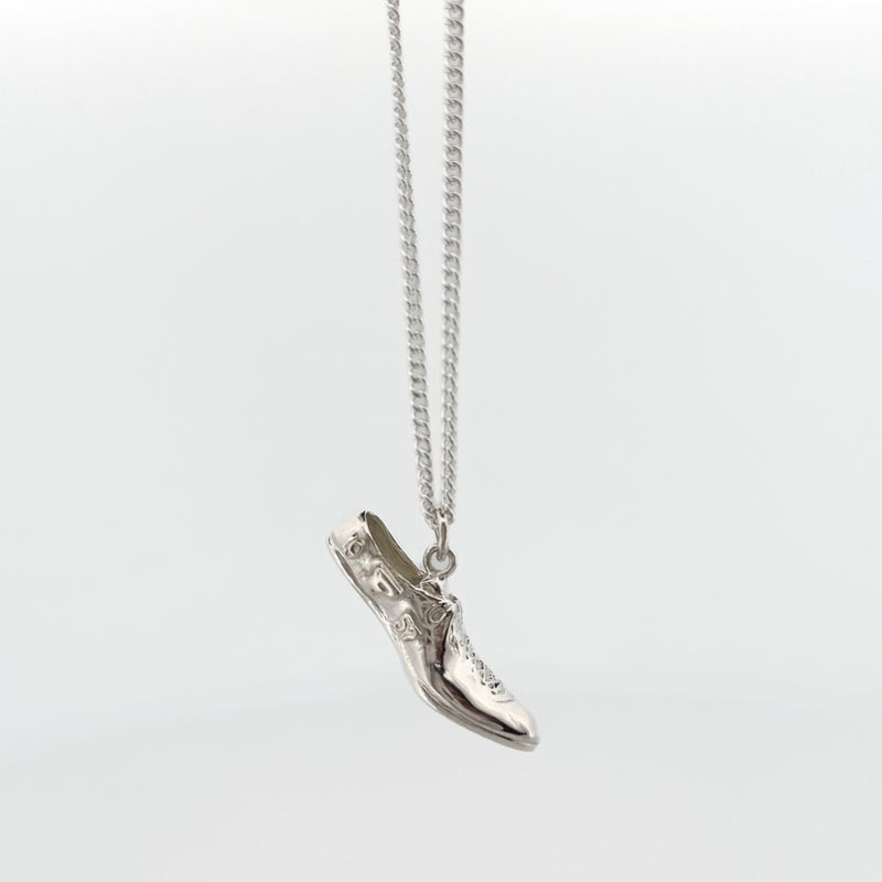 SPRINTT Pendant, a running shoe cast in Argentium silver or 18ct gold on a fine curb chain. Handmade in Melbourne by AGOVIA.
